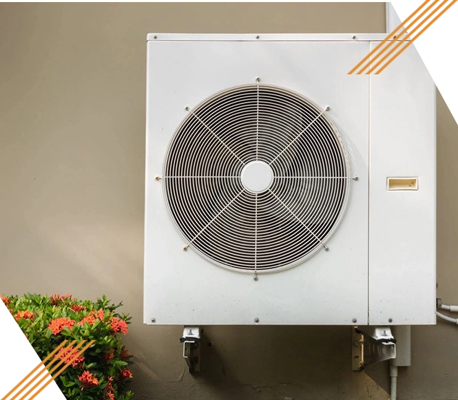 A white air conditioner mounted on the side of a wall.